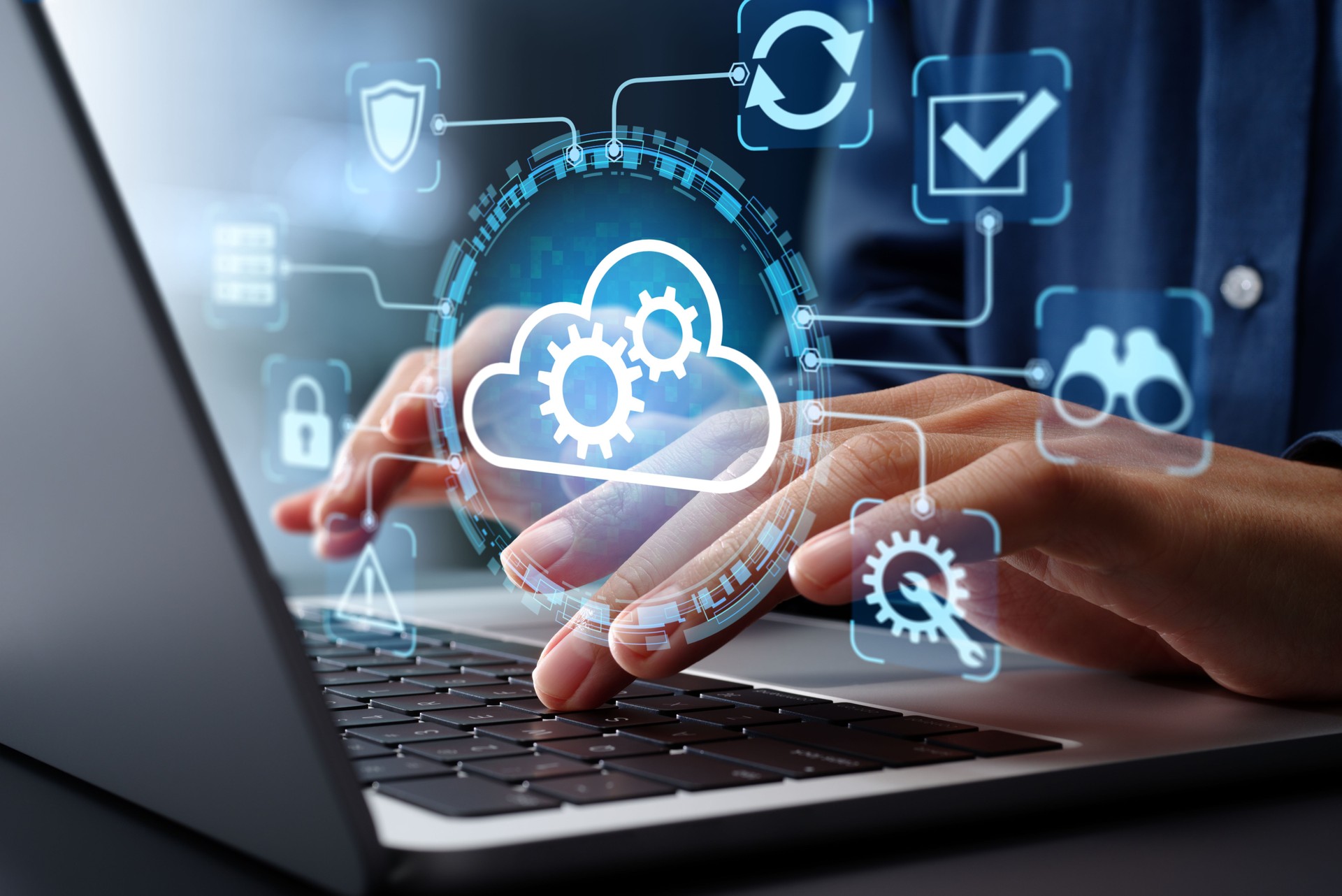 ems. Businessman using laptop computer for cloud computing.